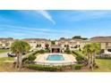 Community pool area surrounded by a black fence and manicured landscape, perfect for relaxation and recreation at 200 Feltrim Reserve Blvd, Davenport, FL 33837
