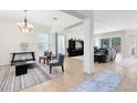 Open-concept living room with lots of natural light and neutral color palette at 2071 Remembrance Ave, St Cloud, FL 34769