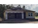 Exterior view of a home under construction, showing the framework, windows, and attached garage at 2292 Broadbrook Drive, St Cloud, FL 34771