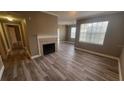 Spacious living room with wood floors and fireplace at 2558 Robert Trent Jones Dr # 1435, Orlando, FL 32835