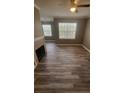 Bright living room with wood floors and fireplace at 2558 Robert Trent Jones Dr # 1435, Orlando, FL 32835