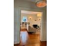 Cozy living room view with hardwood floors, fireplace, and neutral palette at 501 Richmond St, Orlando, FL 32806