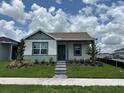 Charming single-story home with well-maintained lawn and walkway leading to the front door at 7408 Olivewood Ave, Orlando, FL 32829
