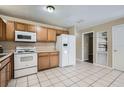Well-lit kitchen featuring ample cabinetry, modern appliances, and tile flooring, perfect for everyday cooking at 830 N Sunset Dr, Mount Dora, FL 32757