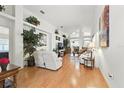 Bright living room with high ceilings, hardwood floors, and lots of natural light at 1752 Challenger Ave, Davenport, FL 33897