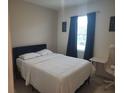 Comfortable bedroom with ample natural light and calming decor at 129 Boydfield Ln, Davenport, FL 33837