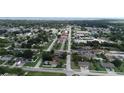 An aerial view of neighborhood and community buildings along a street at 1612 Eastern Ave, St Cloud, FL 34771
