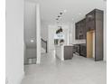 Open kitchen featuring stainless steel appliances, pendant lighting, and a kitchen island at 2018 Packing District Way, Orlando, FL 32804