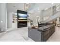 Spacious living room with a fireplace, high ceilings, and staircase at 621 Estates Pl, Longwood, FL 32779