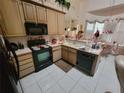 Functional kitchen with essential appliances and ample counter space at 8603 Snowfire Dr, Orlando, FL 32818