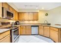 Well-equipped kitchen with stainless steel appliances, granite countertops, and ample cabinet space at 8932 Village Green Blvd, Clermont, FL 34711