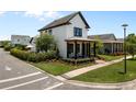 Beautiful two-story home featuring a cozy porch with outdoor seating at 9201 Smithies St, Orlando, FL 32827