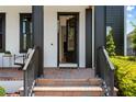 Open front door reveals a glimpse into the home's elegant interior at 9201 Smithies St, Orlando, FL 32827