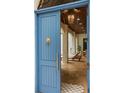 View through elegant arched blue double front door to the outdoor living space at 9809 Covent Garden Dr # Drive, Orlando, FL 32827