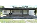 View of a covered carport area with ample space and convenient access to the home at 1390 E Airport Blvd, Sanford, FL 32773