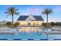 Gorgeous community pool featuring a pristine pool area and a clubhouse with ample seating for residents at 1510 Ridgeback Ln, Apopka, FL 32703