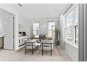 Bright home office with a large window, modern furnishings and calming decor at 2217 Valentine Aly, Orlando, FL 32804