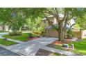 Home exterior showing a two-car garage and meticulously maintained lawn at 2794 Cullens Ct, Ocoee, FL 34761
