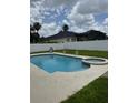 Backyard pool and spa area enclosed by a white fence for privacy and security at 5040 Rock Rose Loop, Sanford, FL 32771