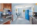 Stylish kitchen with retro refrigerator, custom cabinets and stainless steel appliances at 638 Clayton St, Orlando, FL 32804