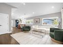 Open-concept living room with hardwood floors, modern furnishings, and plenty of natural light at 1217 Kenwood Ave, Winter Park, FL 32789