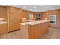 Spacious kitchen featuring custom wooden cabinets, stainless steel appliances, and a large center island at 2250 Blossomwood Dr, Oviedo, FL 32765