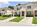 Charming two-story townhome with lush green lawn at 2409 Silver Palm Dr, Kissimmee, FL 34747