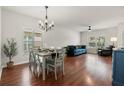 Bright living room with wood floors, a dining area, and large windows at 2733 Big Timber Dr, Kissimmee, FL 34758