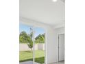 View from inside to patio featuring a sliding glass door to private fenced backyard at 2770 Virginia Pine Dr, Bartow, FL 33830