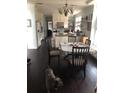 Bright kitchen featuring an eat-in kitchen and modern light fixture at 310 W Lake Ave, Auburndale, FL 33823