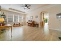 Bright living room featuring hardwood floors, ceiling fan, and neutral paint at 3896 Esplanade Ave, Port Orange, FL 32129