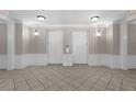 Hallway with access to elevators, featuring tile flooring and decorative wall lighting at 4804 Cayview Ave # 20512, Orlando, FL 32819
