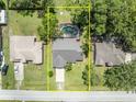 Aerial view of property showing layout with pool, neighboring houses, and street access at 1181 Pine Ln, St Cloud, FL 34771