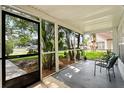 Relaxing screened porch with comfortable seating and view of the lush landscaping at 1358 Brookebridge Dr, Orlando, FL 32825