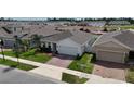 A beautiful single-Gathering home with a well-maintained lawn and brick driveway at 165 Lavenna Ave, St Cloud, FL 34771