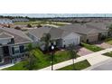 A lovely single-Gathering home with a manicured lawn and beautiful landscaping at 165 Lavenna Ave, St Cloud, FL 34771