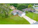 Charming single-story home with well-maintained lawn and attached two car garage at 339 Colony Ct, Kissimmee, FL 34758