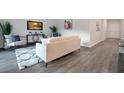 A modern living room is designed with stylish accents and hardwood floors at 3408 Curlew Ave, Leesburg, FL 34748