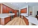 Modern kitchen boasting granite counters, stainless appliances, and ample cabinet space, perfect for entertaining at 604 Timberwilde Ct, Winter Springs, FL 32708