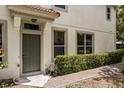 Charming front entrance with neatly trimmed hedges and brick walkway at 6874 Slaven Dr, Orlando, FL 32819