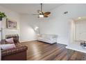 Bright living room features hardwood floors and fireplace with stylish decor at 940 Douglas Ave # 159, Altamonte Springs, FL 32714