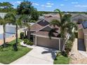 Lovely single-story home featuring a two-car garage, and mature palms at 144 Bridgeton St, Davenport, FL 33896