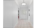 Bright entryway with tile flooring, leading to the main living areas at 16950 Se 80Th Bellavista Cir, The Villages, FL 32162