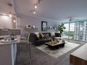 Bright living room featuring modern decor, stylish furniture, and scenic water views at 322 E Central Blvd # 1412, Orlando, FL 32801