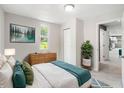 Comfortable bedroom featuring a serene view, a wooden dresser, modern finishes and tile flooring at 4925 Catfish Rd, Lake Wales, FL 33898