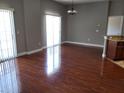 Living room featuring hardwood floors with lots of natural light at 6416 S Goldenrod Rd # 8A, Orlando, FL 32822