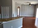 Open living room with hardwood floors, ceiling fan, and natural light at 6416 S Goldenrod Rd # 8A, Orlando, FL 32822