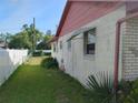 Home exterior featuring a fenced yard and stucco walls at 1152 Ring St, Deltona, FL 32725