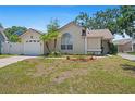 Lovely single-story home features a manicured lawn, attached garage, and charming landscaping at 126 Spanish Moss Ct, Orlando, FL 32828