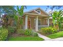 Charming single-Gathering home featuring a landscaped front yard and inviting front porch at 12868 Holdenbury Ln, Windermere, FL 34786